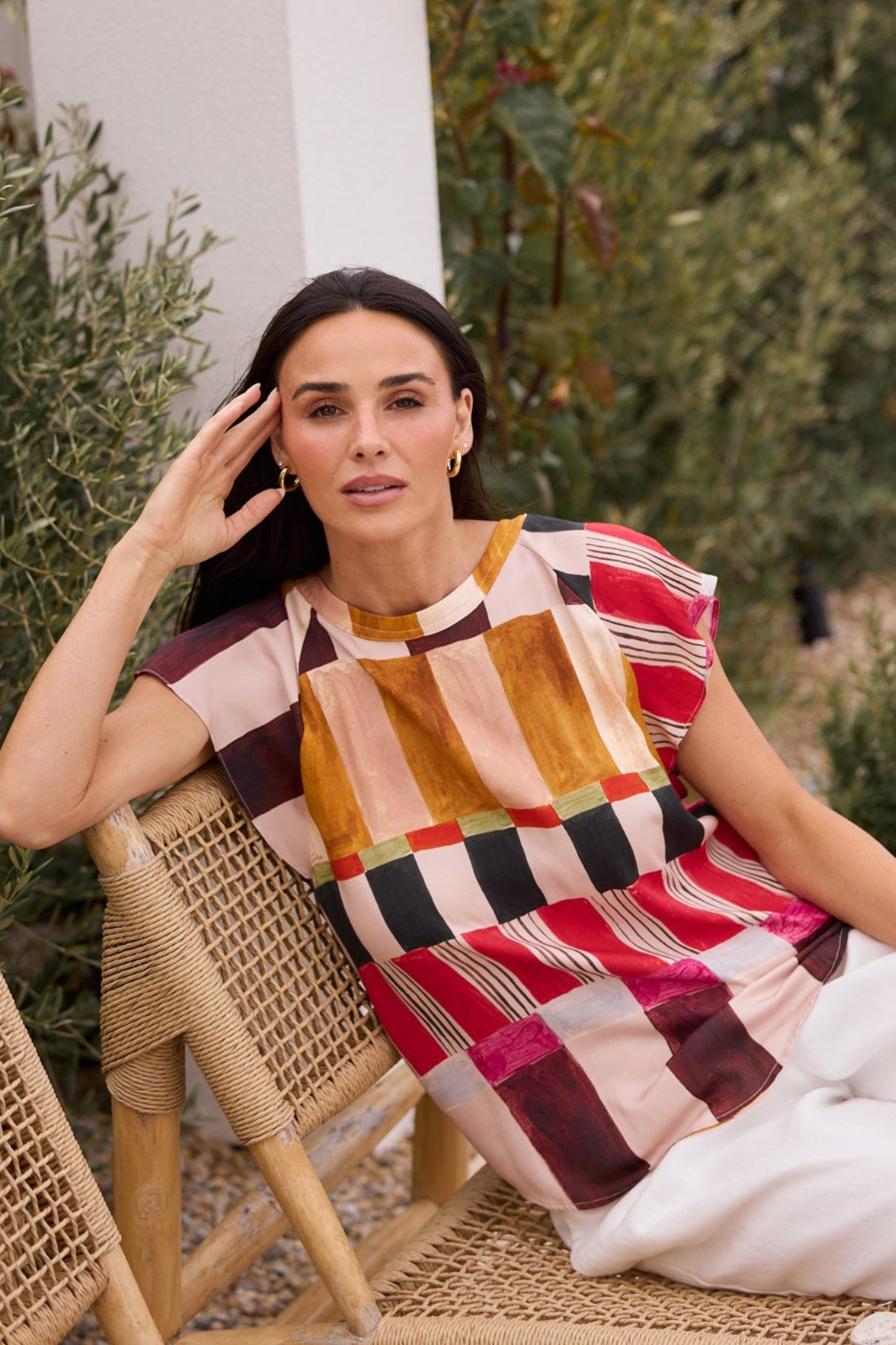 Model styling Boulevard Top in Painterly Geo by Brave + True, campaign lifestyle look.