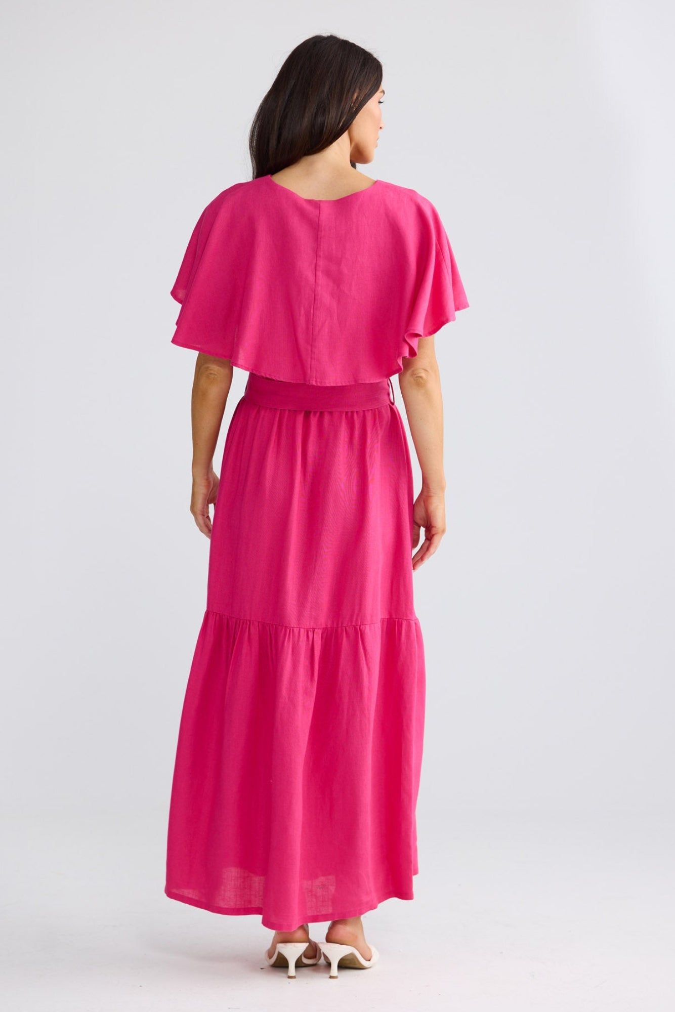Model wearing Long Way Home Dress in Fuchsia by Brave + True, view 2.