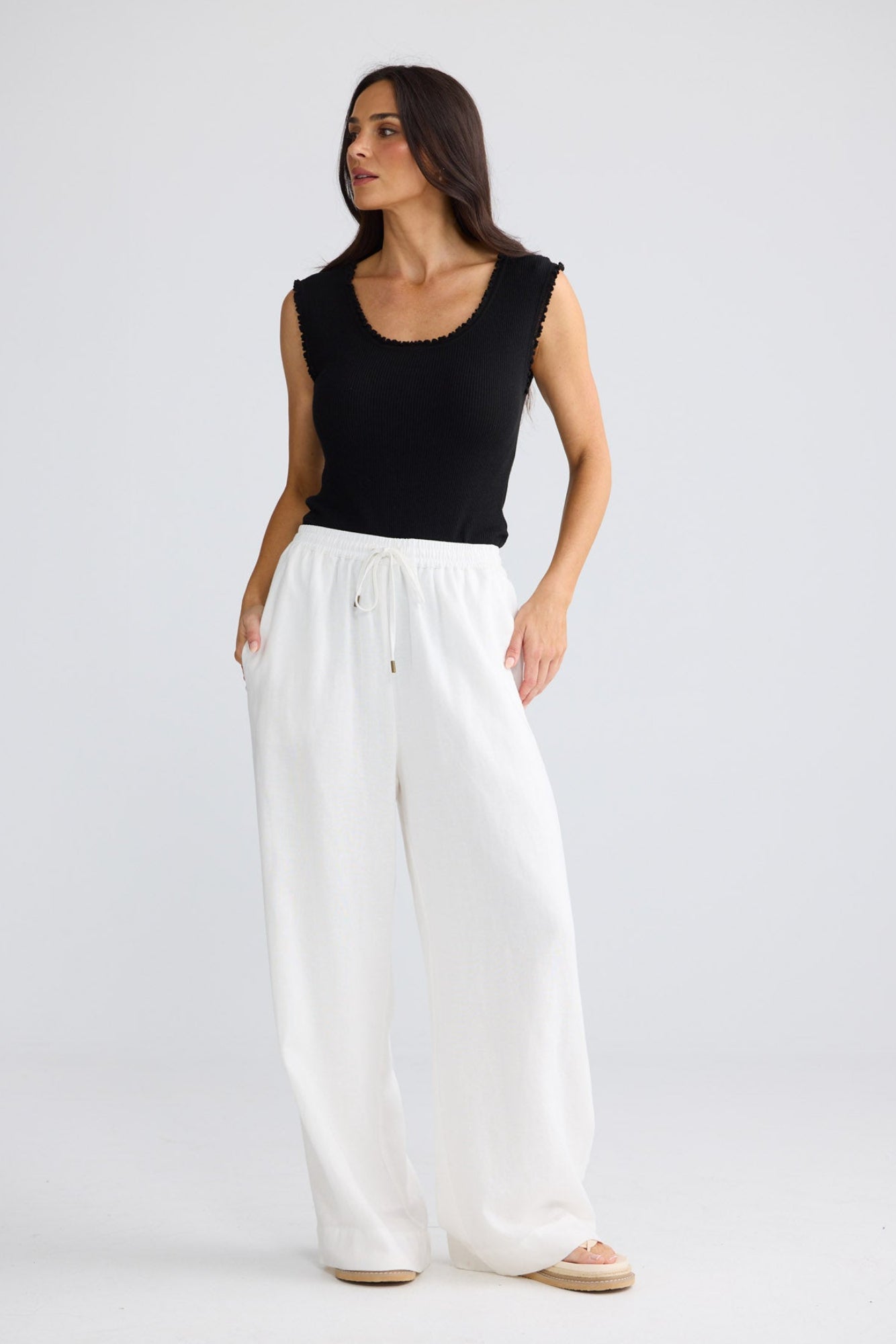 Model wearing Jude Pant in White by Brave + True, view 2.