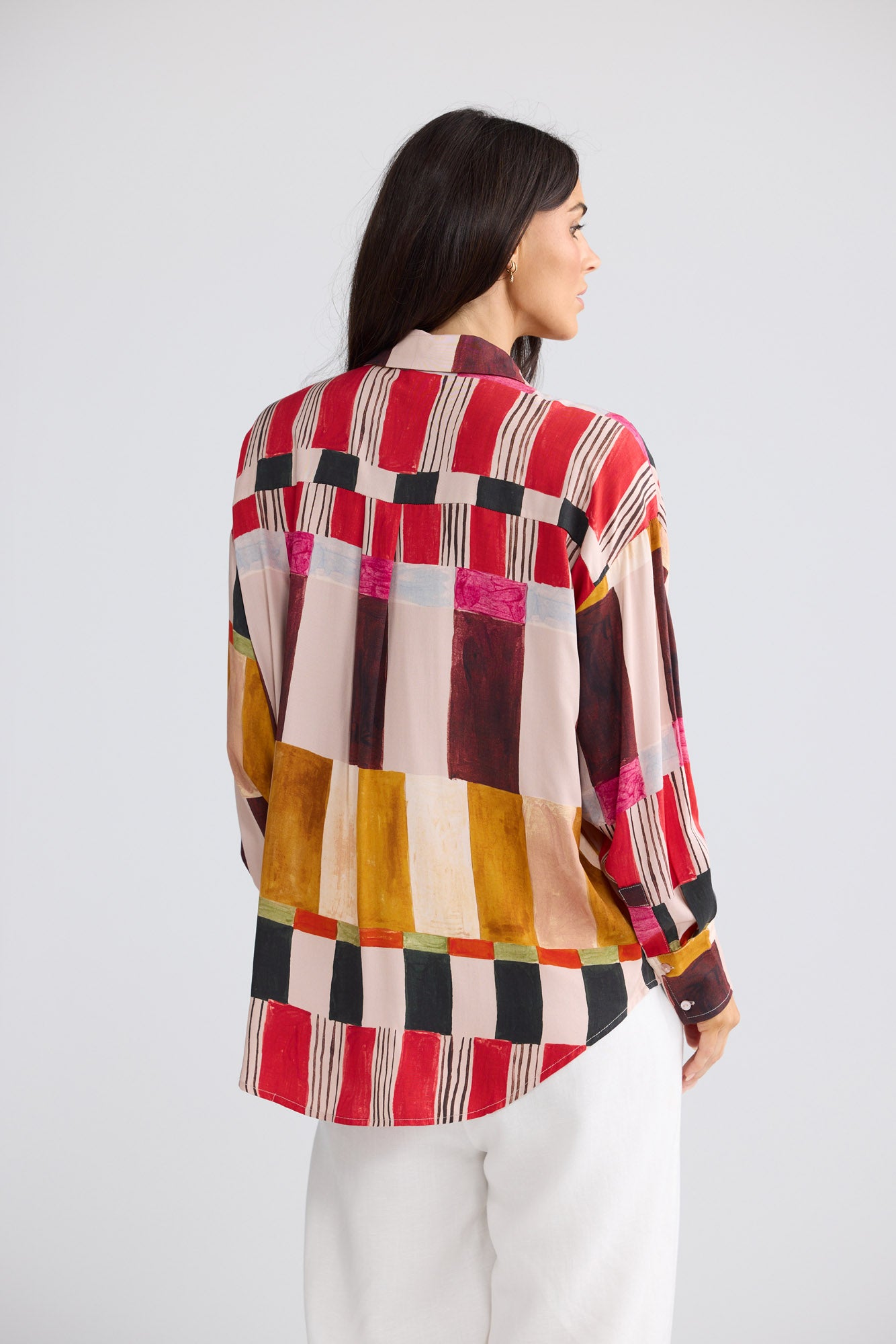 Model wearing Glenda Shirt in painterly geo print by Brave + True, front view.