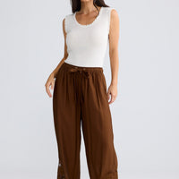 Model wearing Astrid Pant in Bronze by Brave + True, view 3.