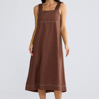 Model wearing Megan Dress in coffee by brave+true, front view showing square neckline.