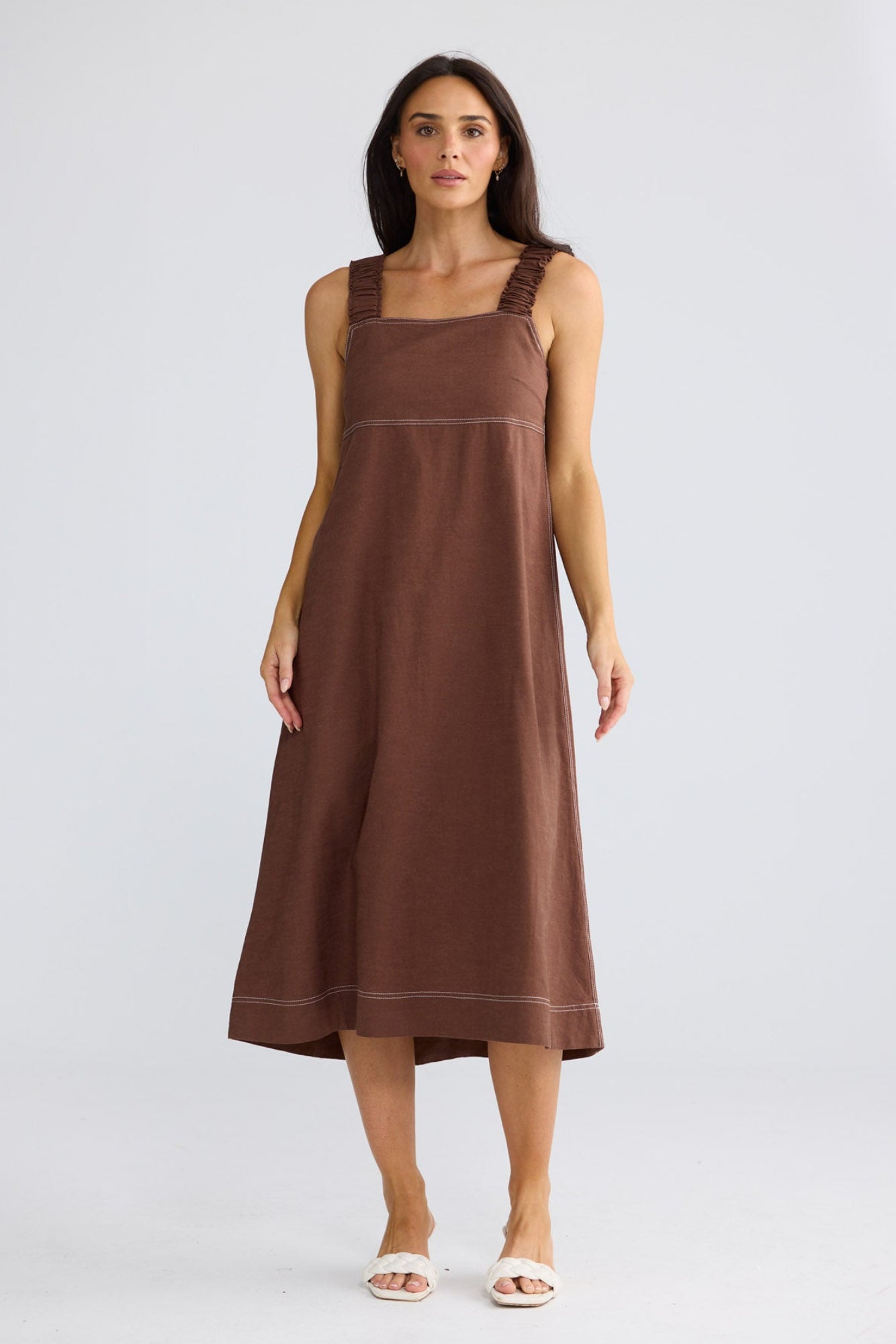 Model wearing Megan Dress in coffee by Brave + True, front view showing square neckline.
