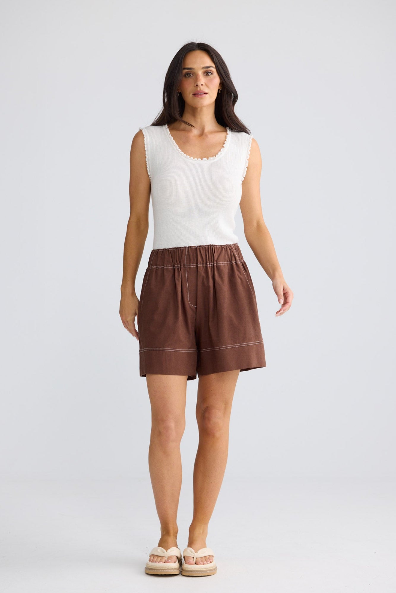 Model wearing Esplanade Short in coffee by Brave + True, front view showing elasticated waistband.