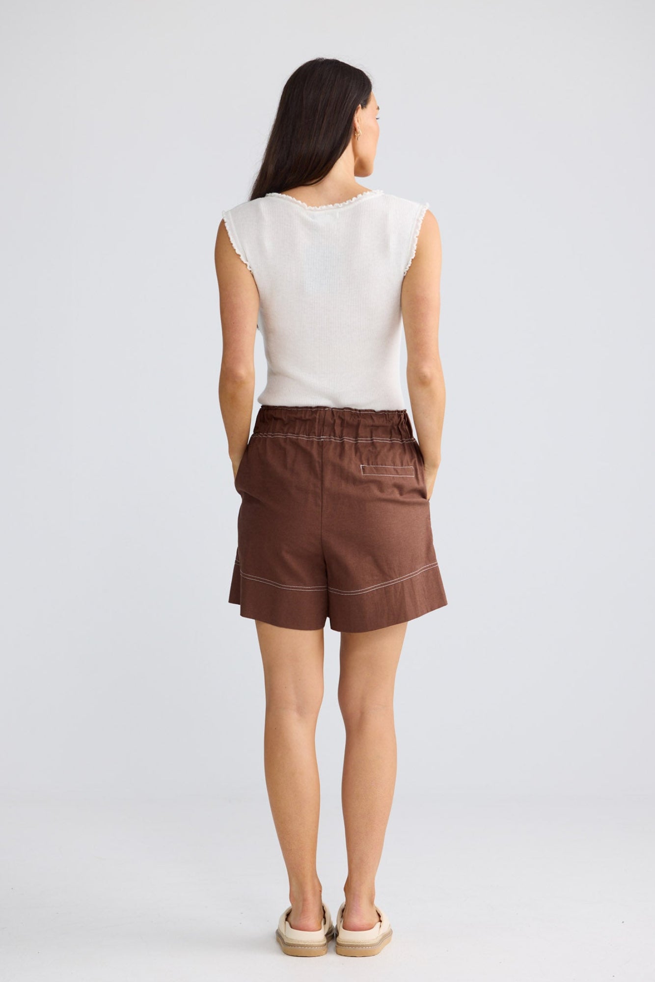 Model wearing Esplanade Short in Coffee by Brave + True, view 3.
