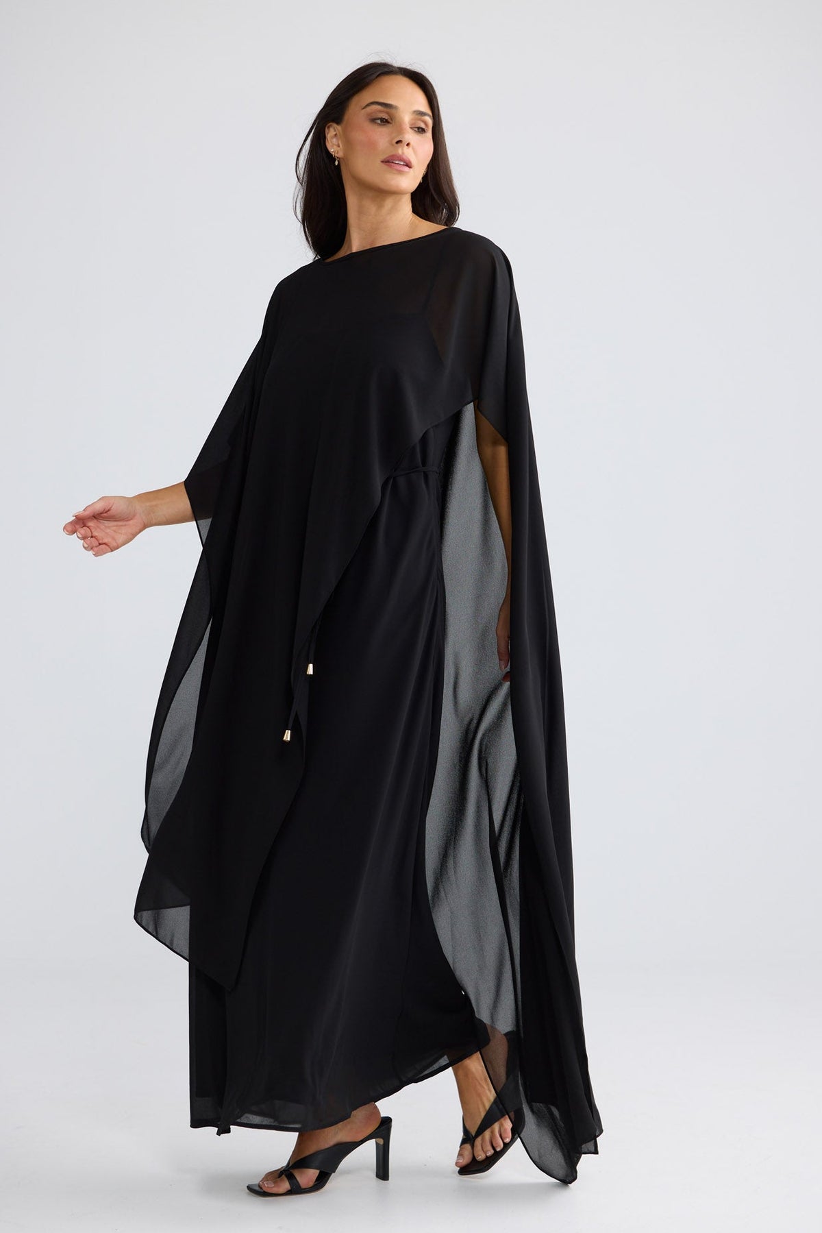 Model wearing Park Avenue Cape in Black by Brave + True, view 2.