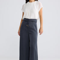 Model wearing Kensington Pant in Graphite by Brave + True, view 2.