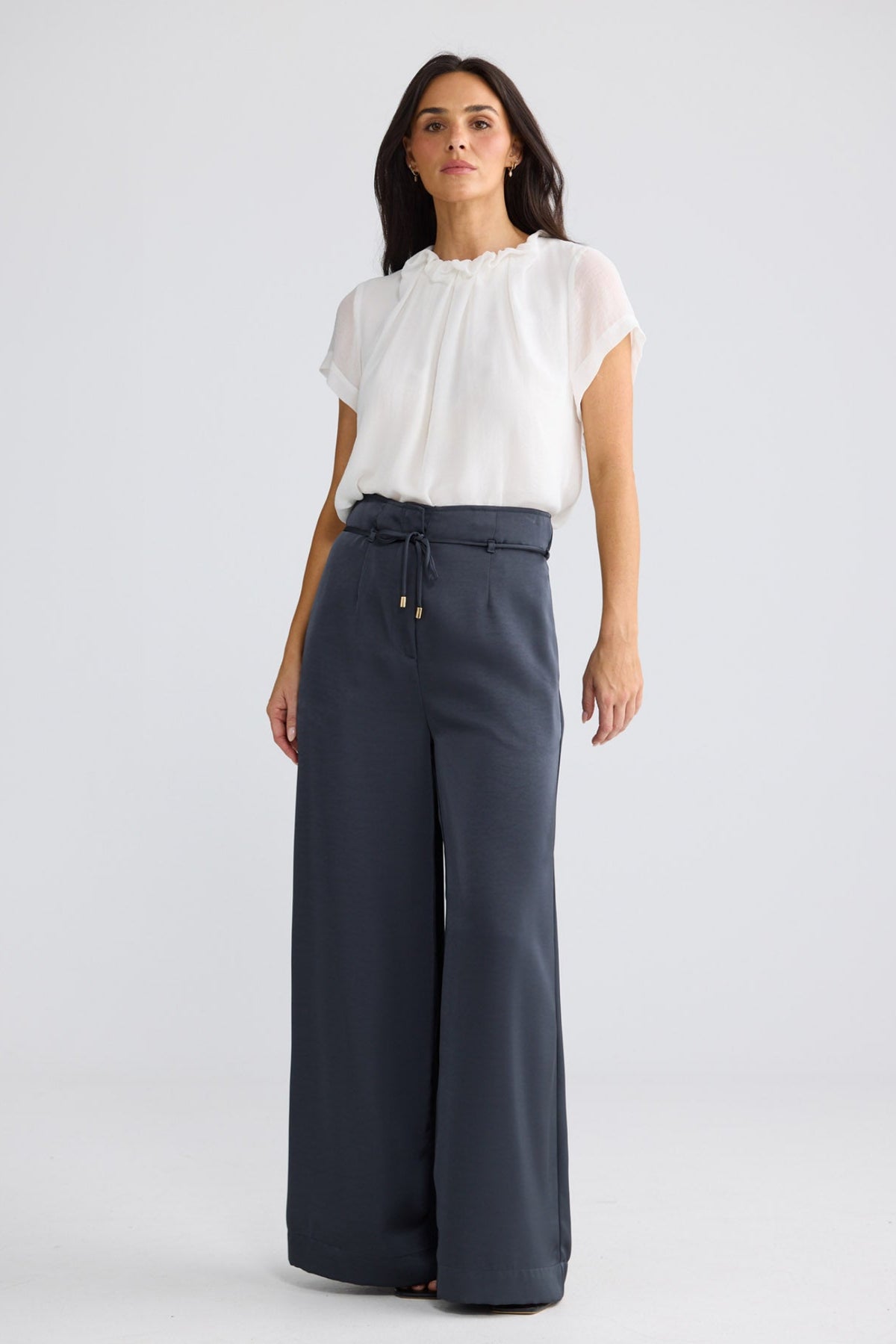 Model wearing Kensington Pant in Graphite by Brave + True, view 2.