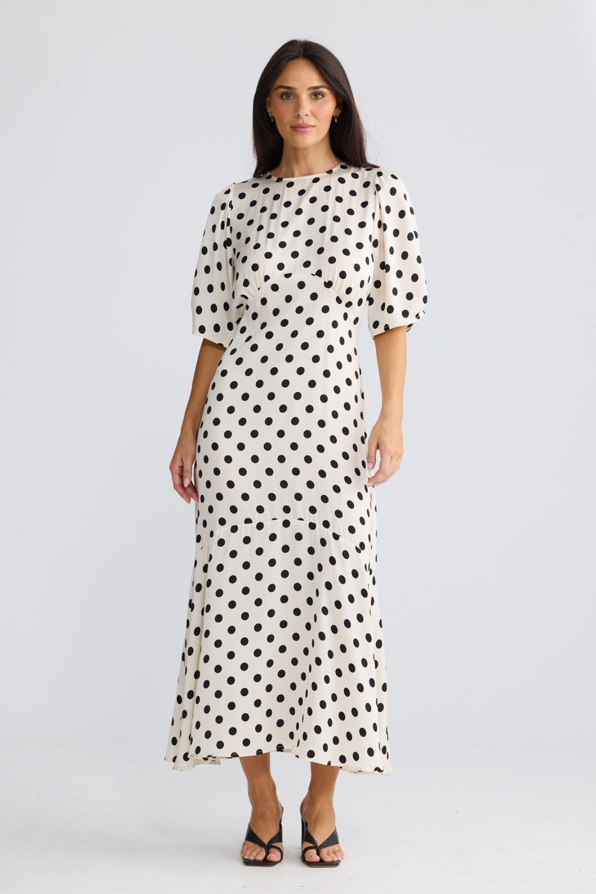 Model wearing Jocelyn Dress in Ivory Spot by Brave + True, view 2.