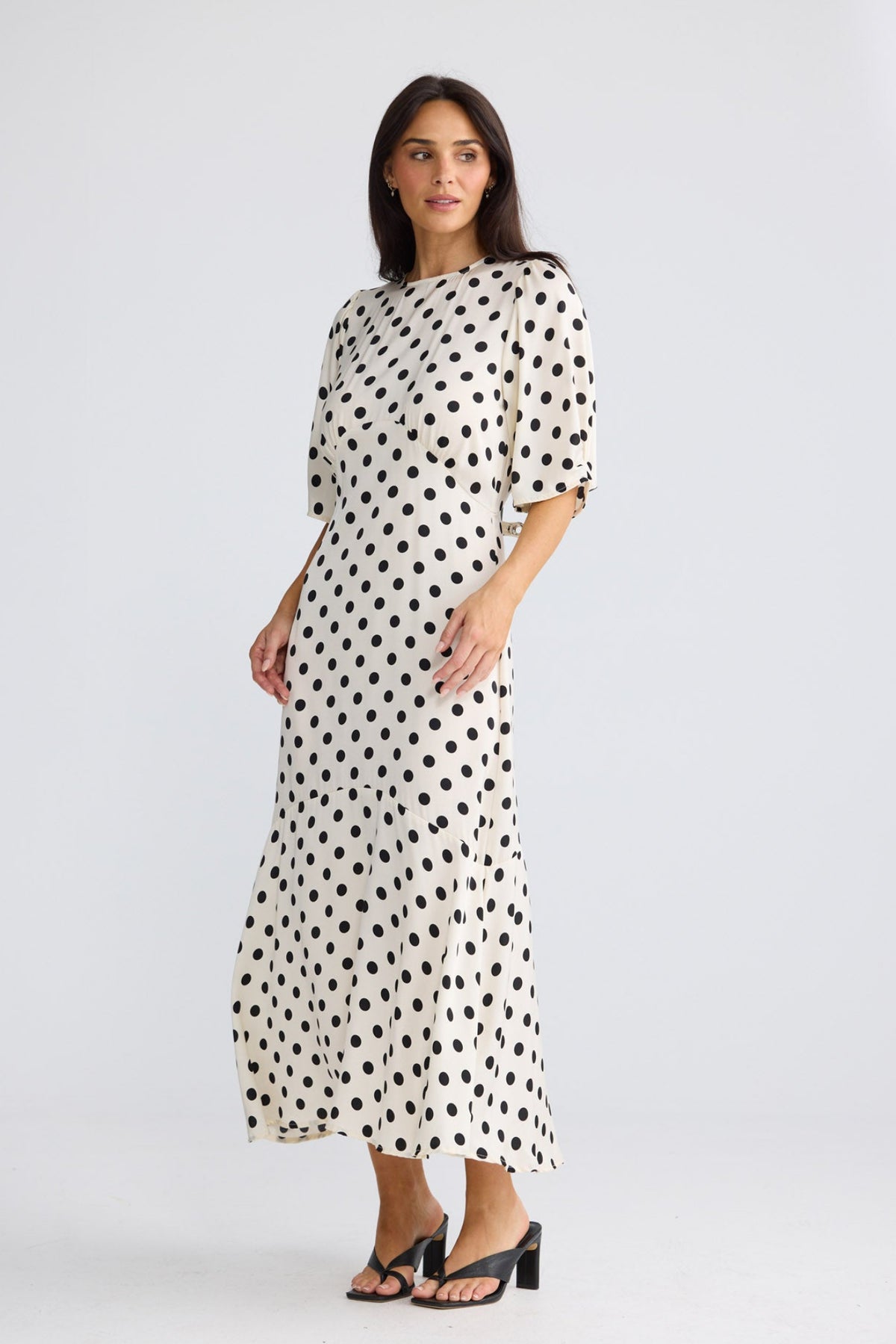 Model wearing Jocelyn Dress in Ivory Spot by Brave + True, view 3.