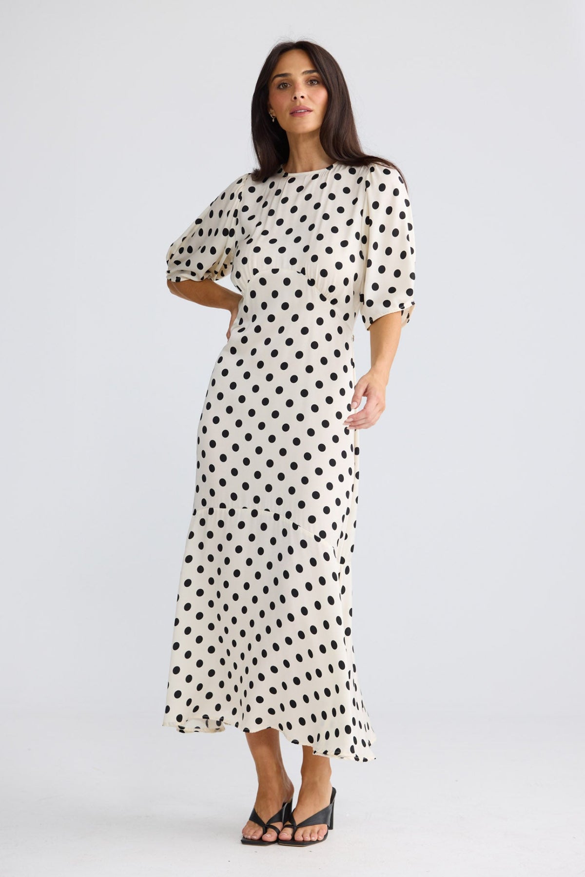 Model wearing Jocelyn Dress in Ivory Spot by Brave + True, view 4.