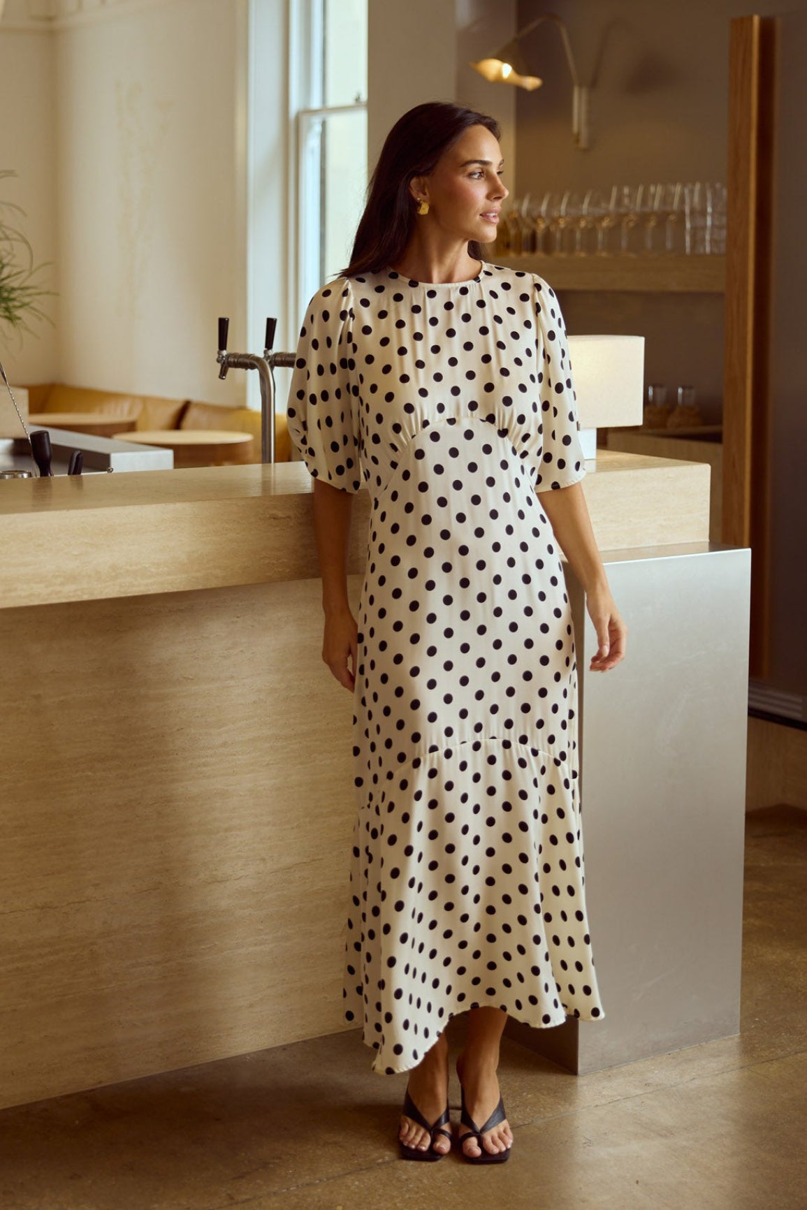 Model styling Jocelyn Dress in Ivory Spot by Brave + True, campaign lifestyle look.