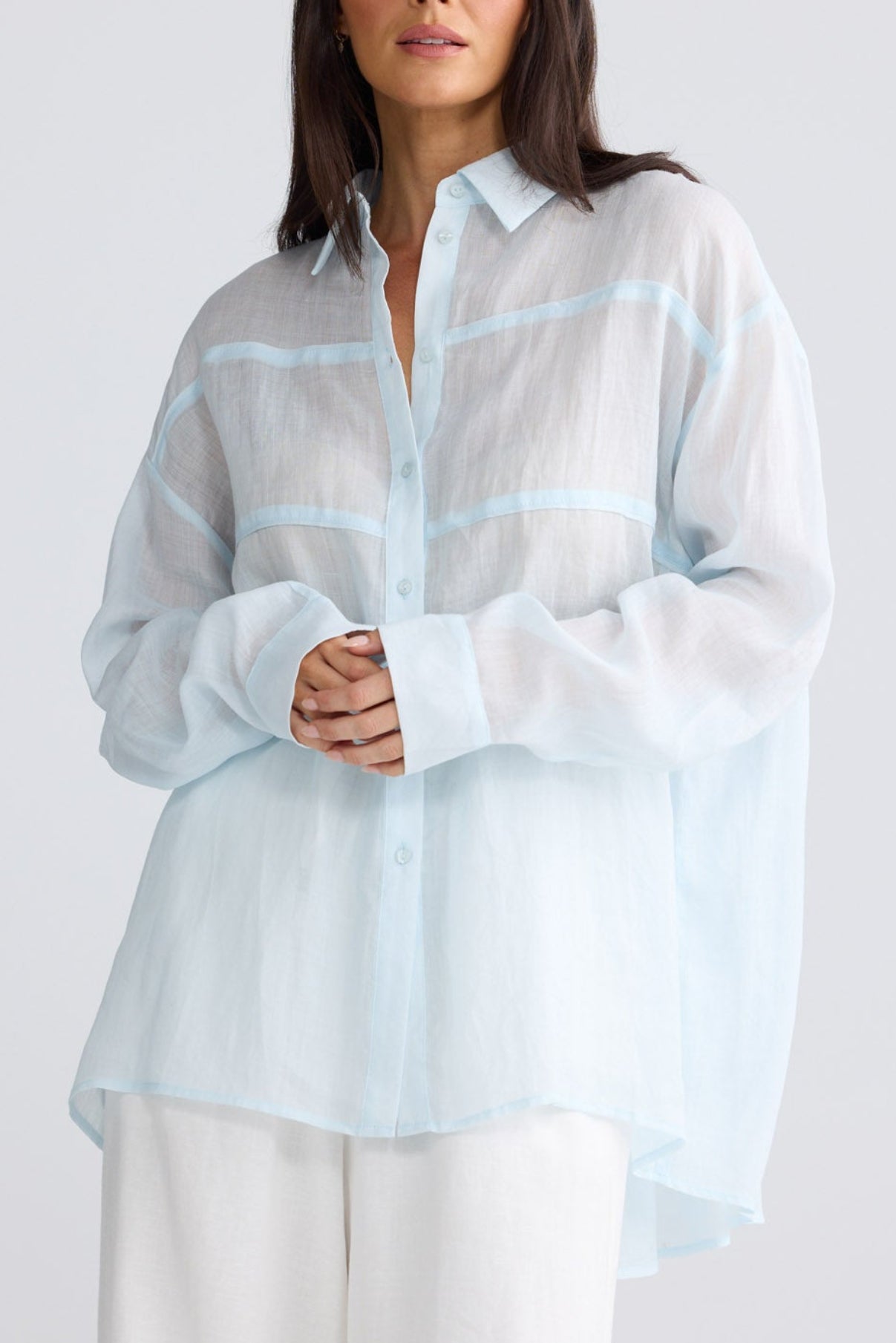 Model wearing Louis Shirt in powder blue by Brave + True, front view showing oversized linen fit.