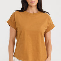 Model wearing Sandra Tee in taupe by Brave + True, front view with relaxed fit.