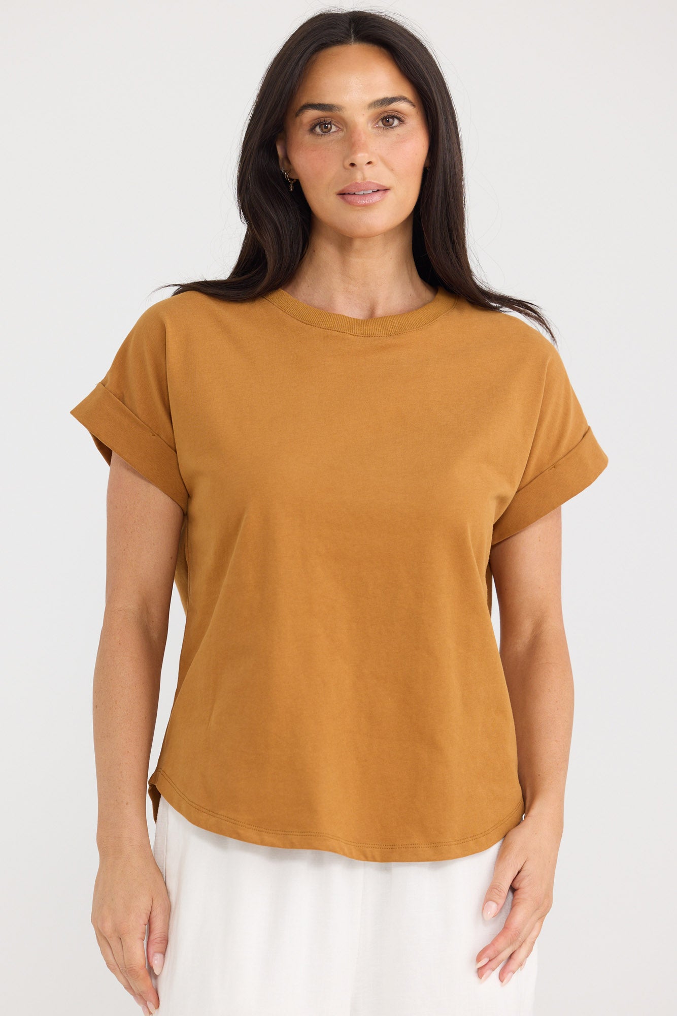 Model wearing Sandra Tee in taupe by Brave + True, front view with relaxed fit.