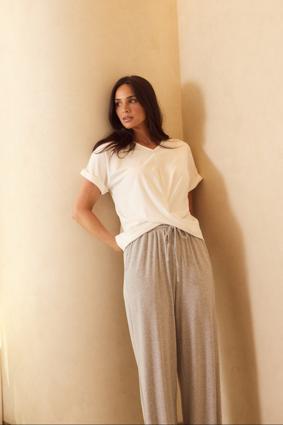 Model styling Rapture Tee in White by Brave + True, campaign lifestyle look.