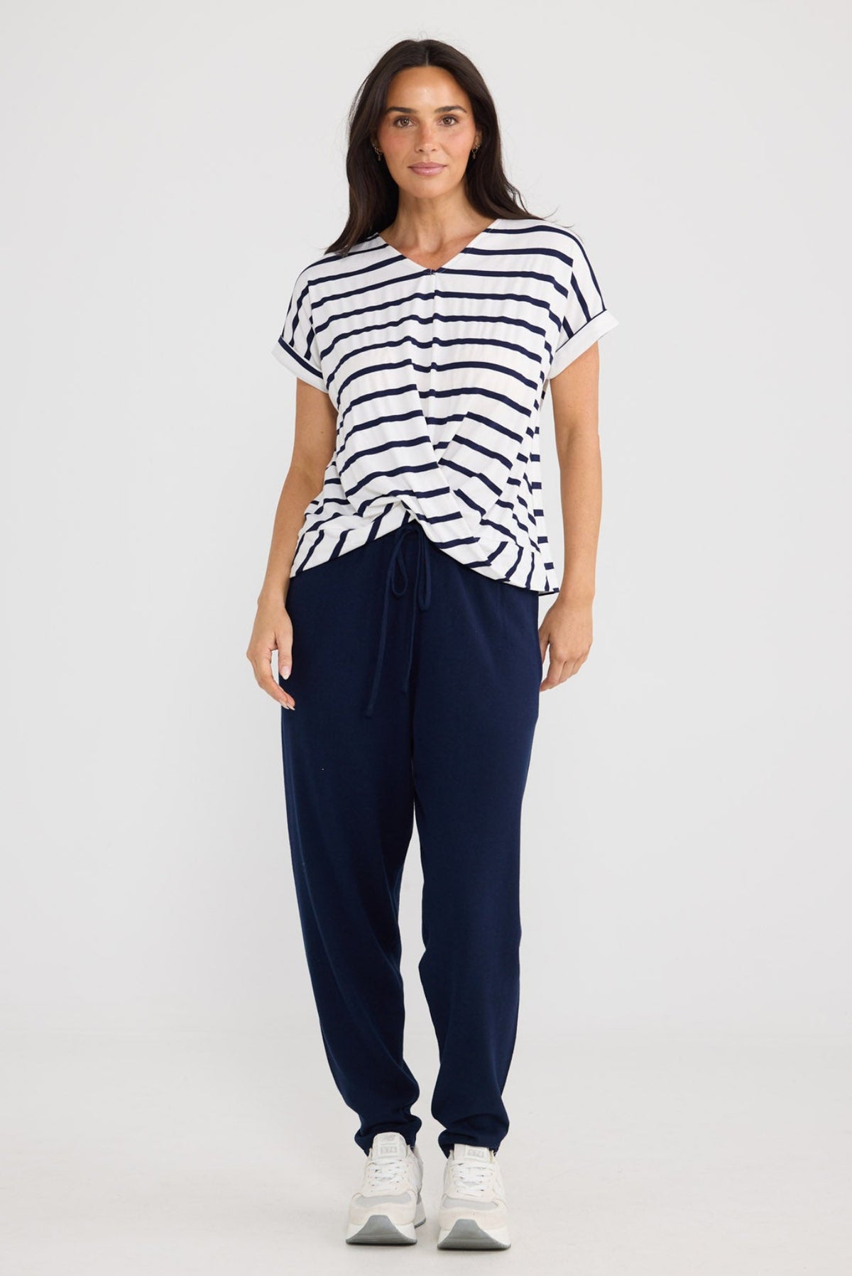 Model wearing Rapture Tee in navy white stripe with twist front by Brave + True.