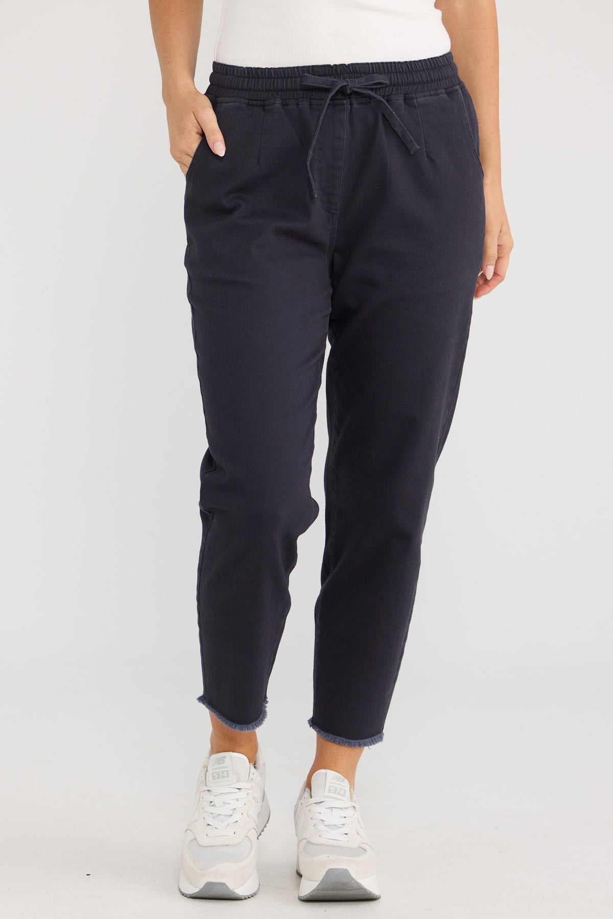 Model wearing Wayfarer Pant in Navy by Brave + True, view 4.