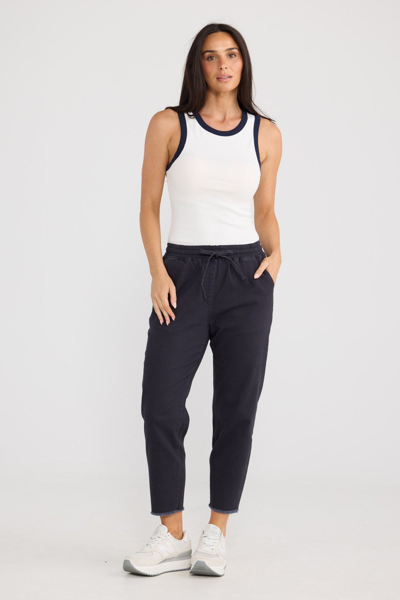 Model wearing Wayfarer Pant in Navy by Brave + True, view 2.