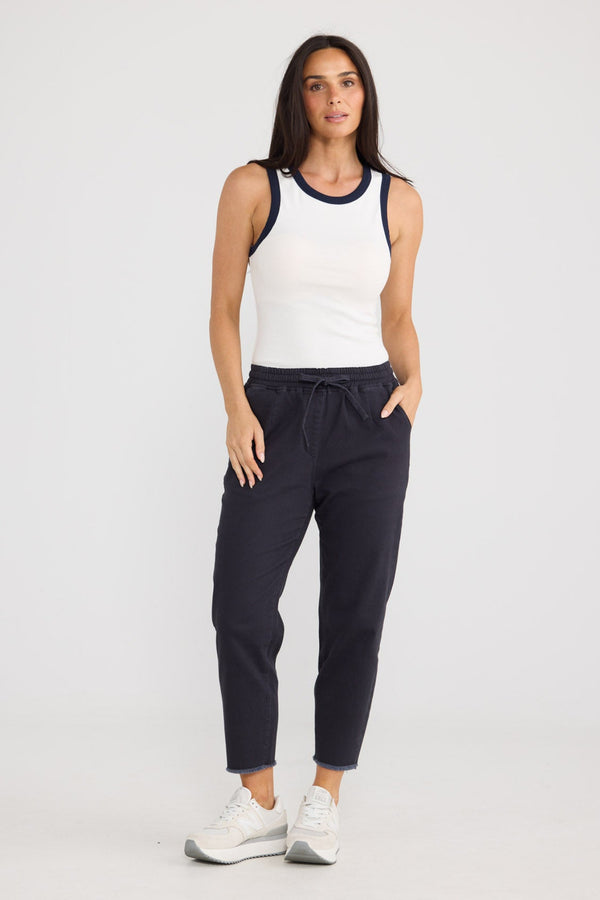 Model wearing Wayfarer Pant in Navy by Brave + True, view 2.