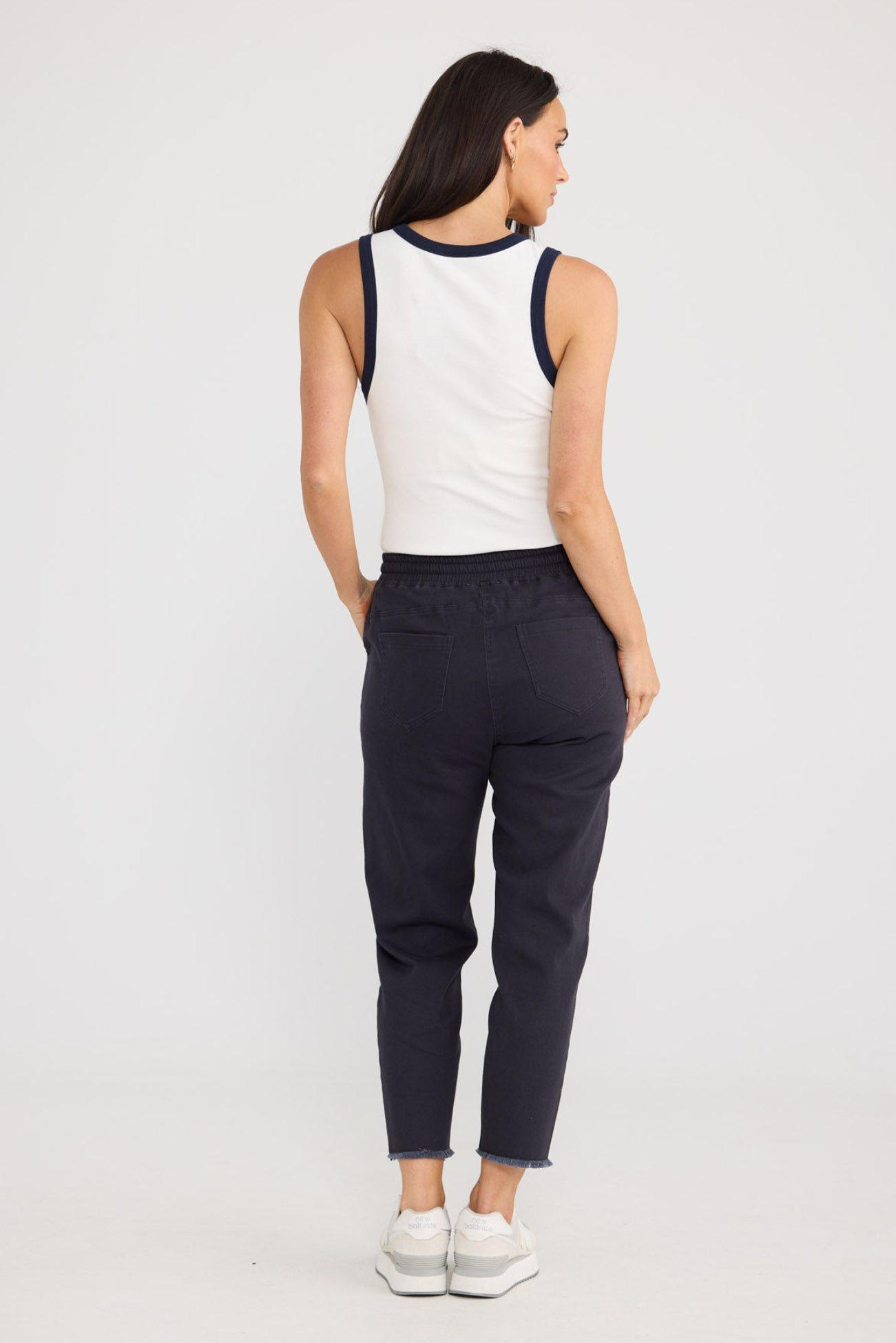 Model wearing Wayfarer Pant in Navy by Brave + True, view 3.