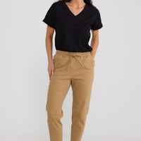 Model wearing Wayfarer Pant in Taupe by Brave + True, view 4.