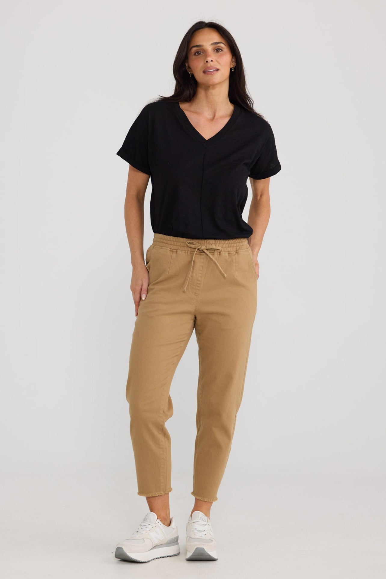 Model wearing Wayfarer Pant in Taupe by Brave + True, view 4.