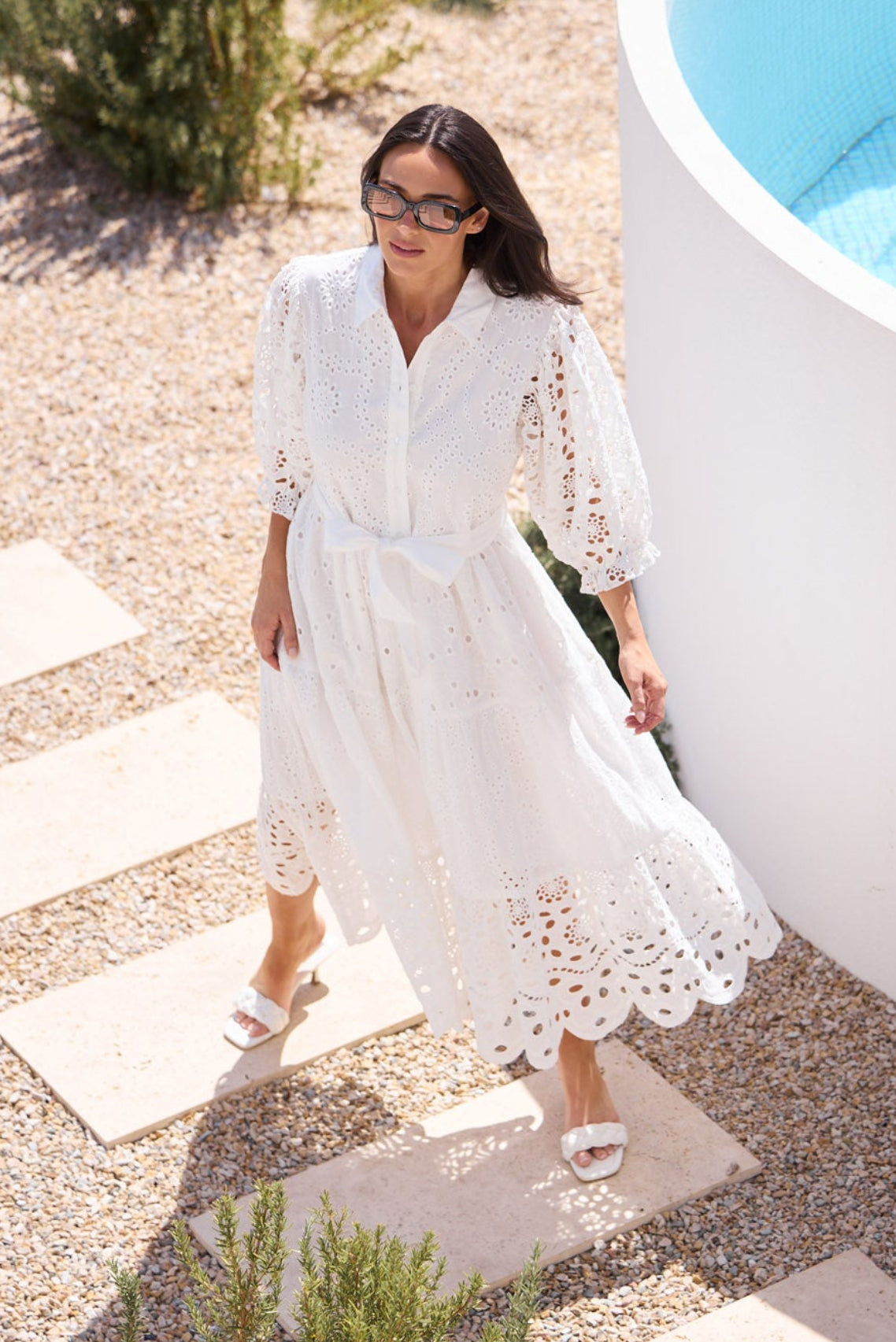 Model styling Donnie Dress in White by Brave + True, campaign lifestyle look.