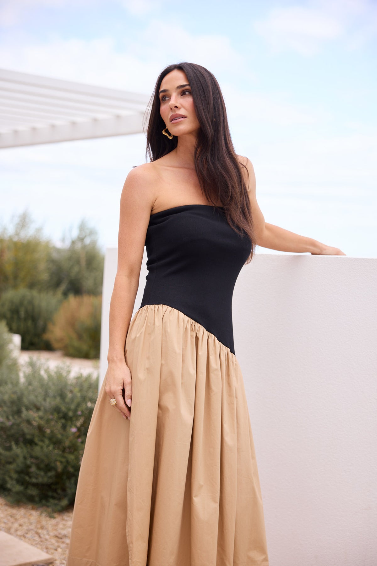 Model styling Sonita Dress in Black by Brave + True, campaign lifestyle look.