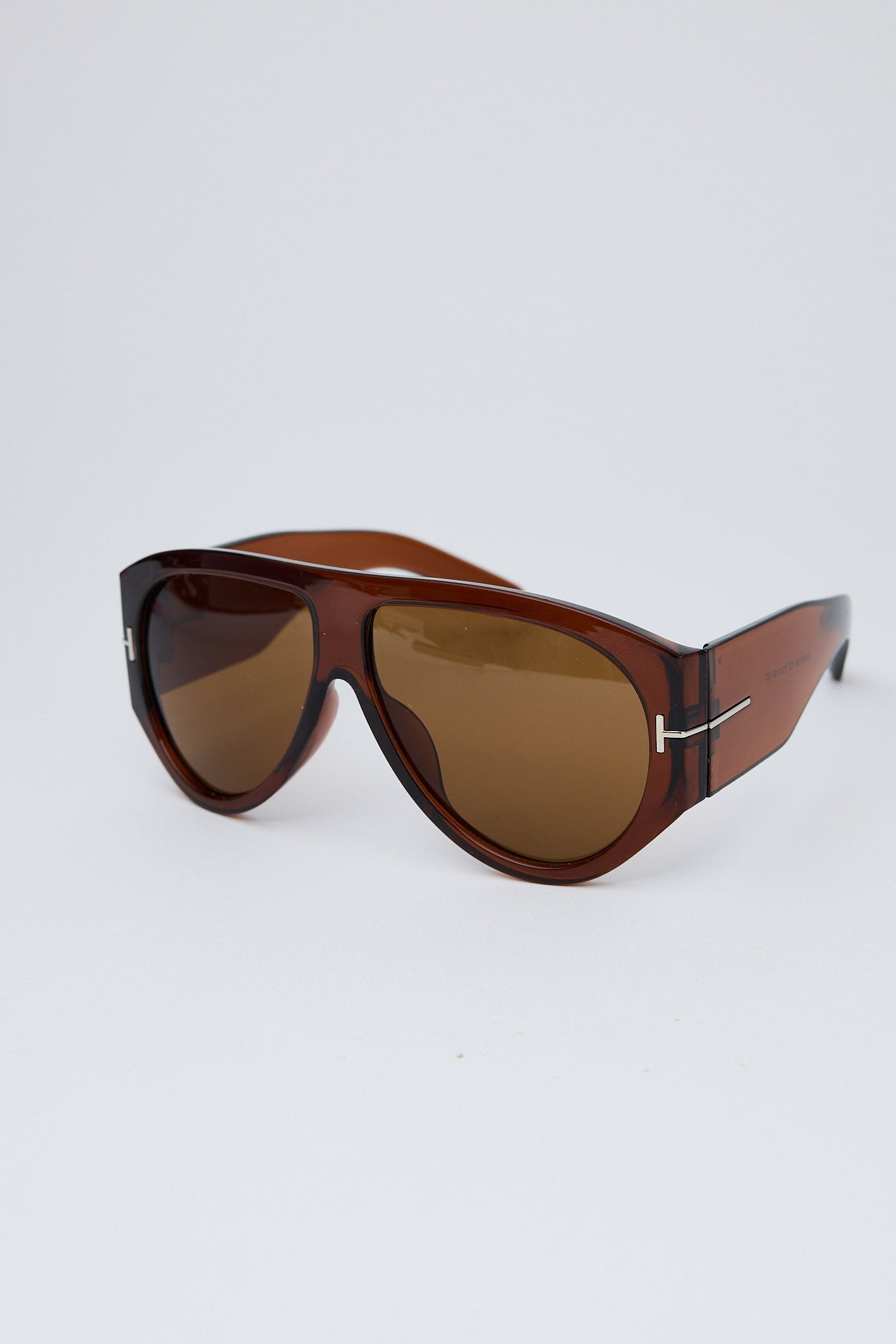 Angled view of Brown Paparazzi Sunglasses on white background