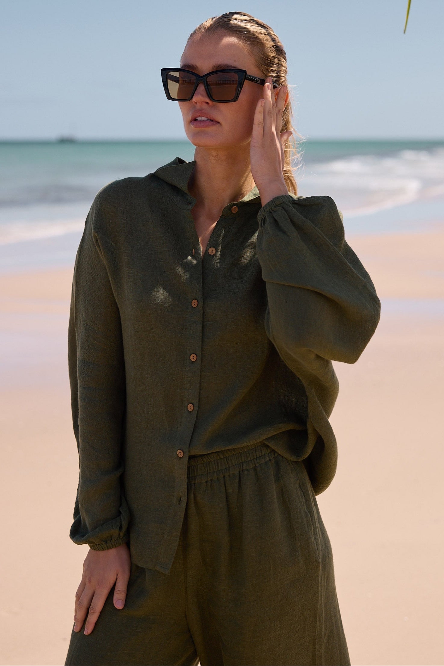 Model wearing black w orange venice sunglasses