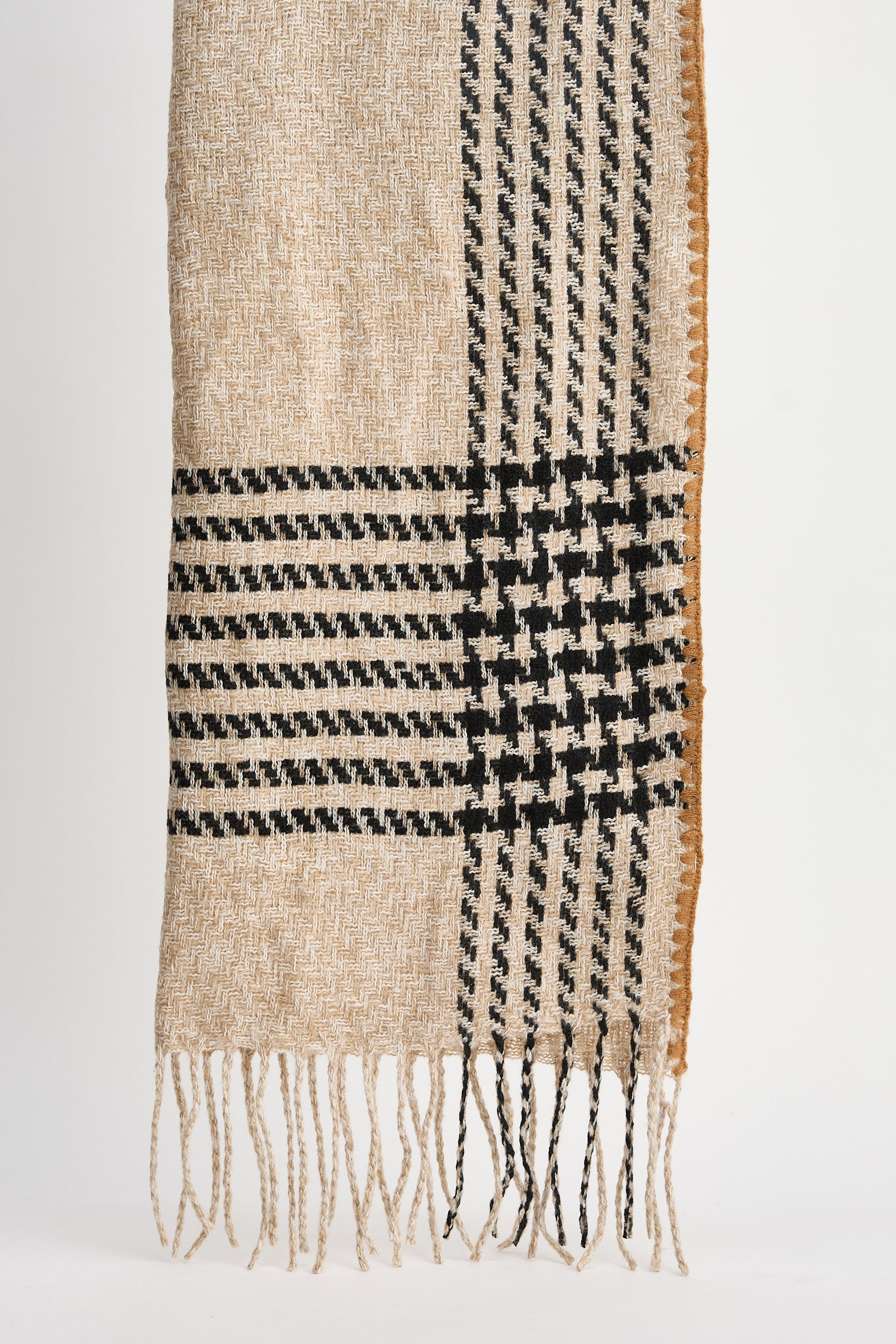 Plaid scarf with beige and black pattern on a white background