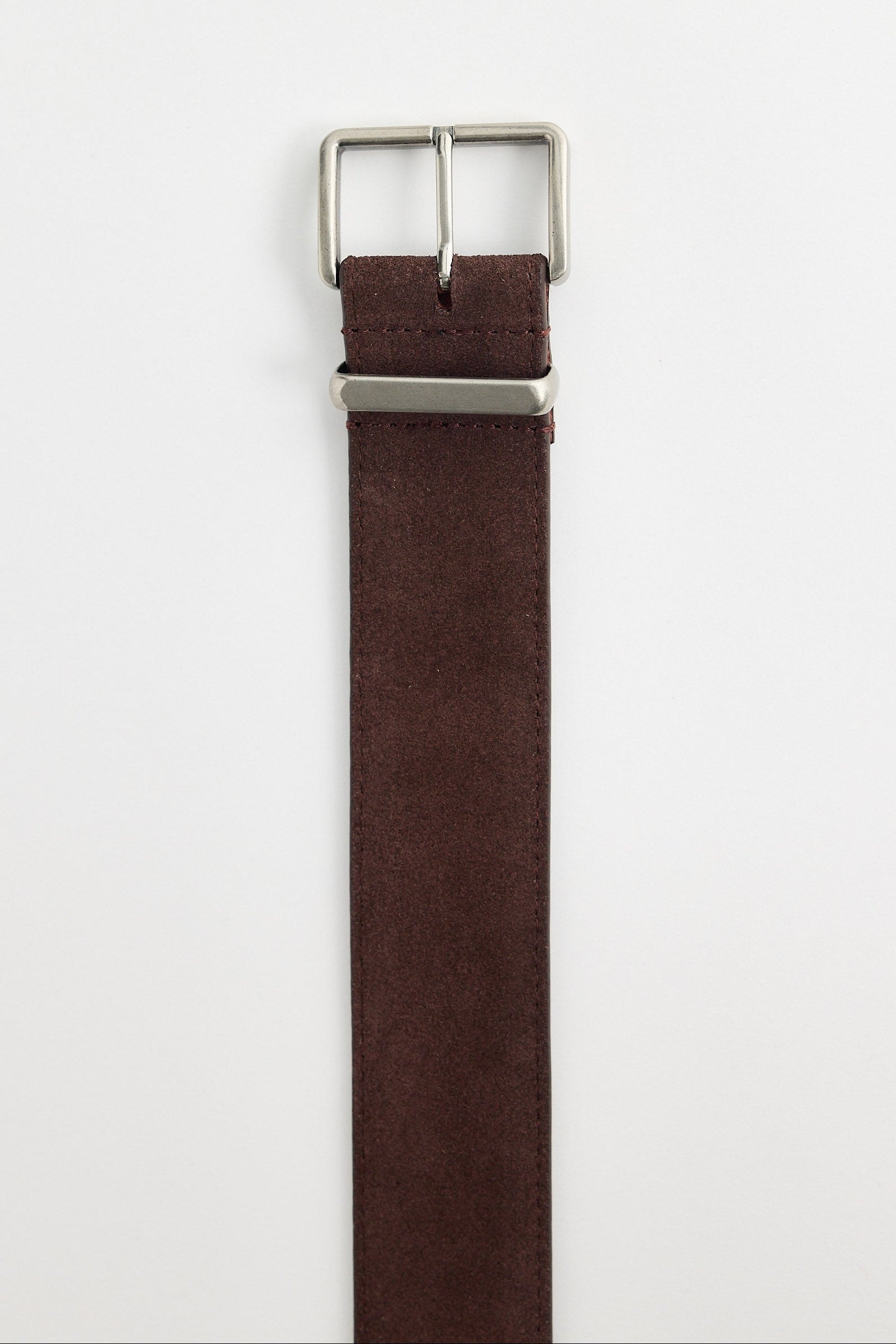 Brown belt with silver buckle on a white background