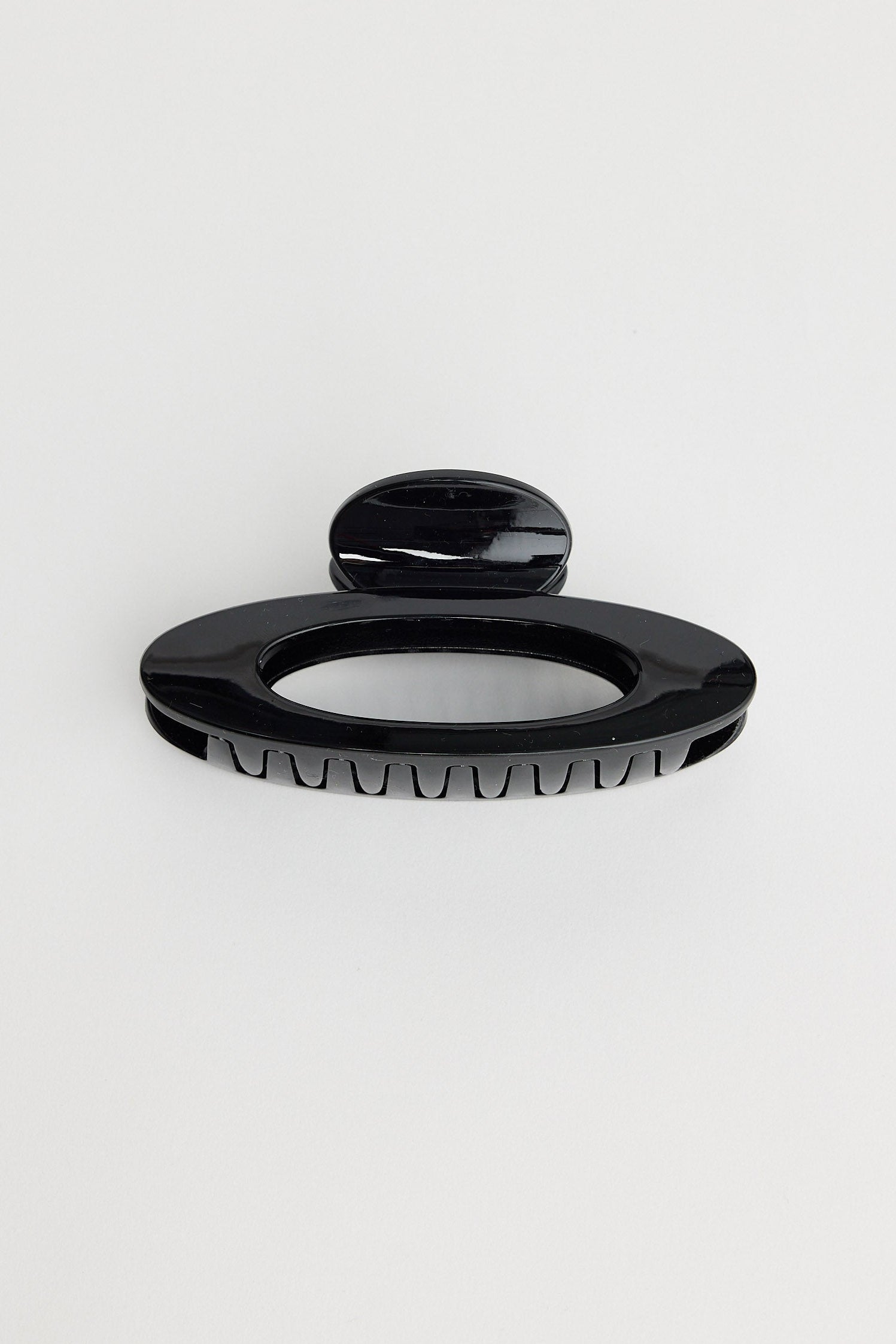 Black hair claw on white background