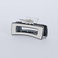 Webster Hair Claw - Off White hair claw in off white with glossy finish, front view.