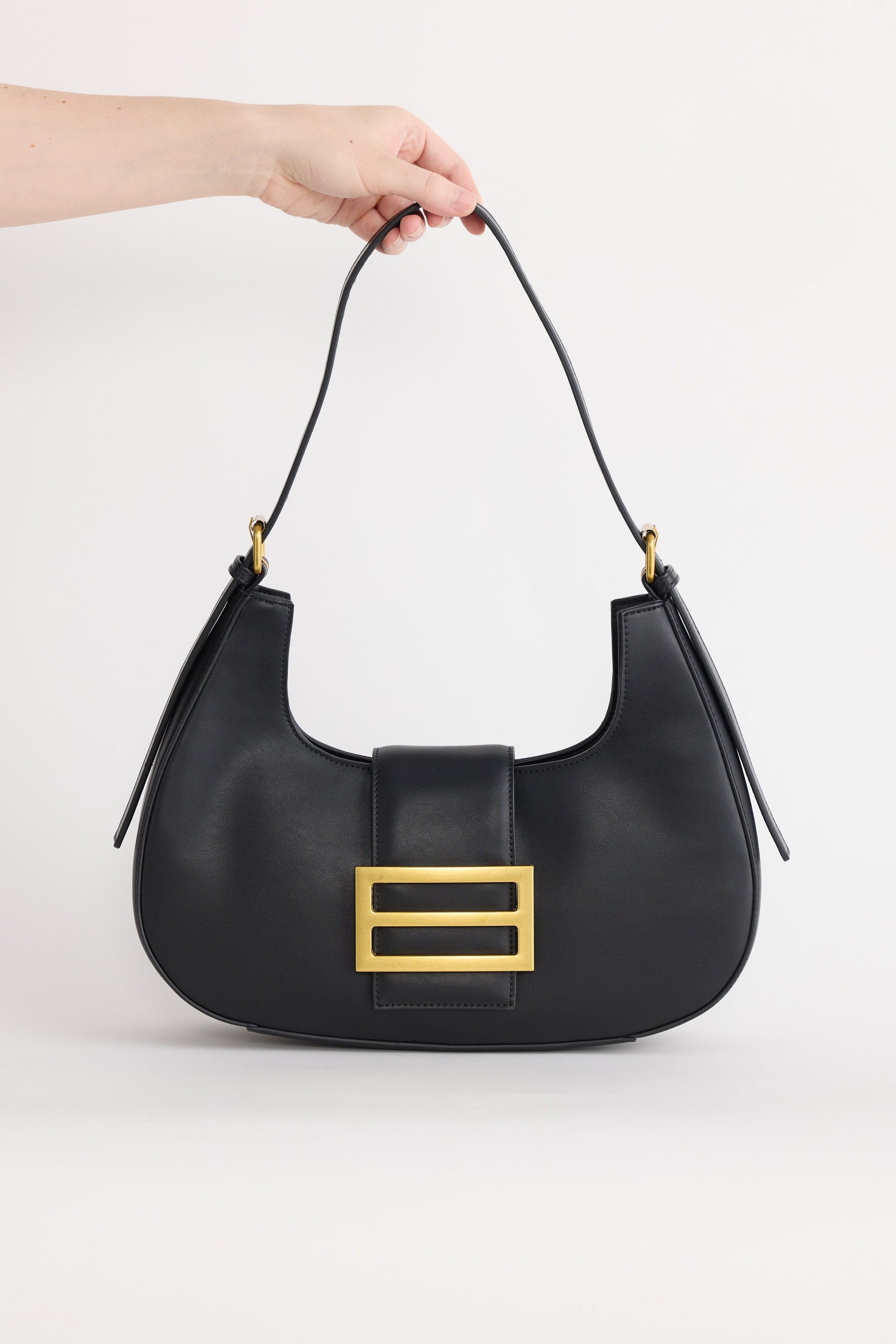 Virginia Handbag - Black handbag in black with gold-tone hardware, front view on white background