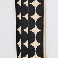 Paloma Scarf - Black scarf in black with geometric weave, front view on white background