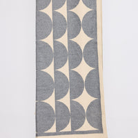 Paloma Scarf - Grey scarf in grey with geometric weave, front view on white background