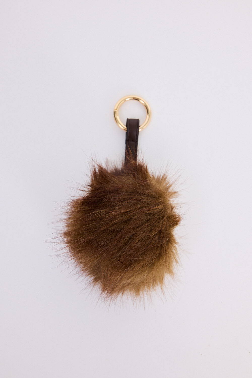 Luna Keyring - Brown keyring in brown with faux fur pom detail, front view.