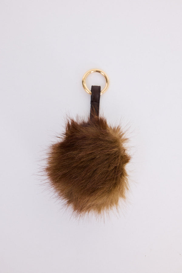 Luna Keyring - Brown keyring in brown with faux fur pom detail, front view.