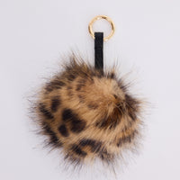 Luna Keyring - Leopard keyring in leopard with faux fur pom detail, front view.