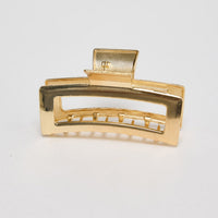 Shelby Hair Claw in gold - front view of the rectangular metal hair claw