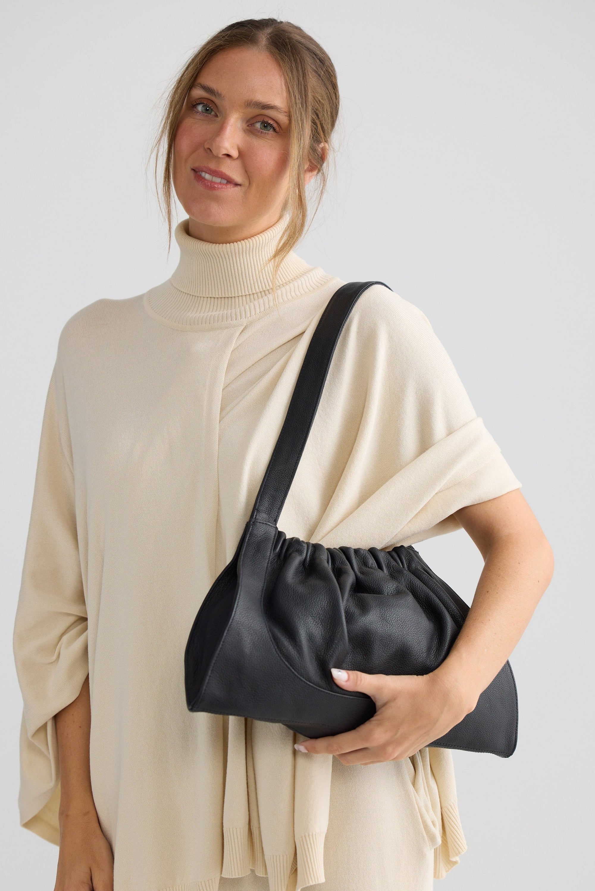 Fraser Bag - Black bag in black with gathered silhouette, styled view on white background