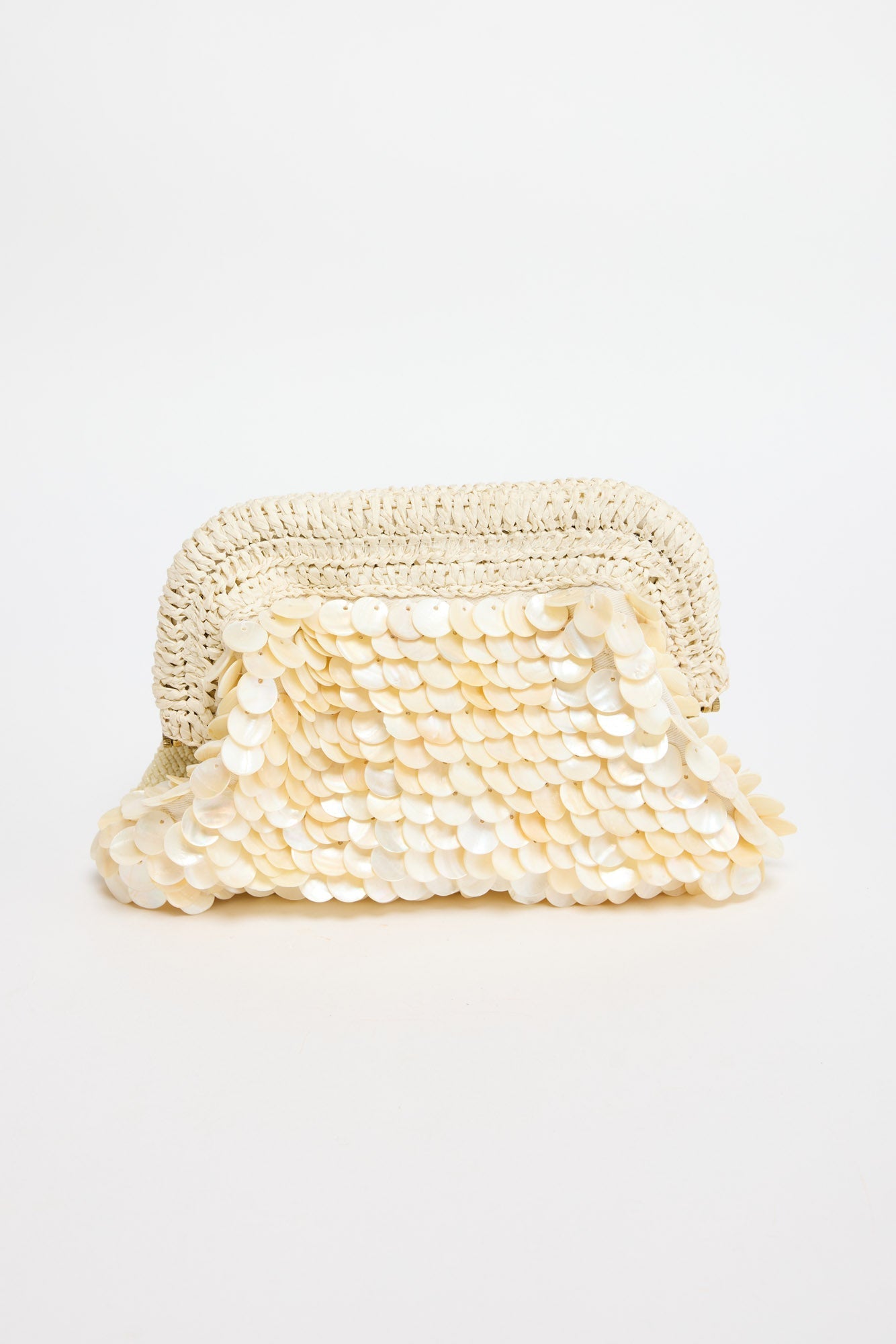 Sandy Clutch in creme - front view, fully covered in layered mother-of-pearl shell discs with a woven raffia frame