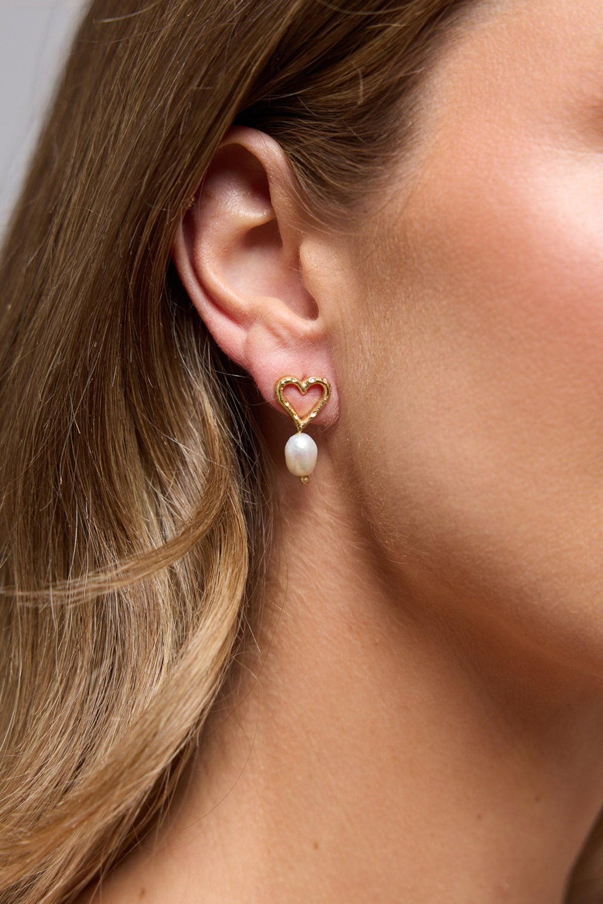 Bengali Earrings in gold, front view.