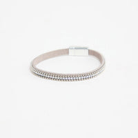 Harper Bracelet in silver-tone finish, showing the grey suede band, row of clear crystals, ball-chain trim and magnetic clasp