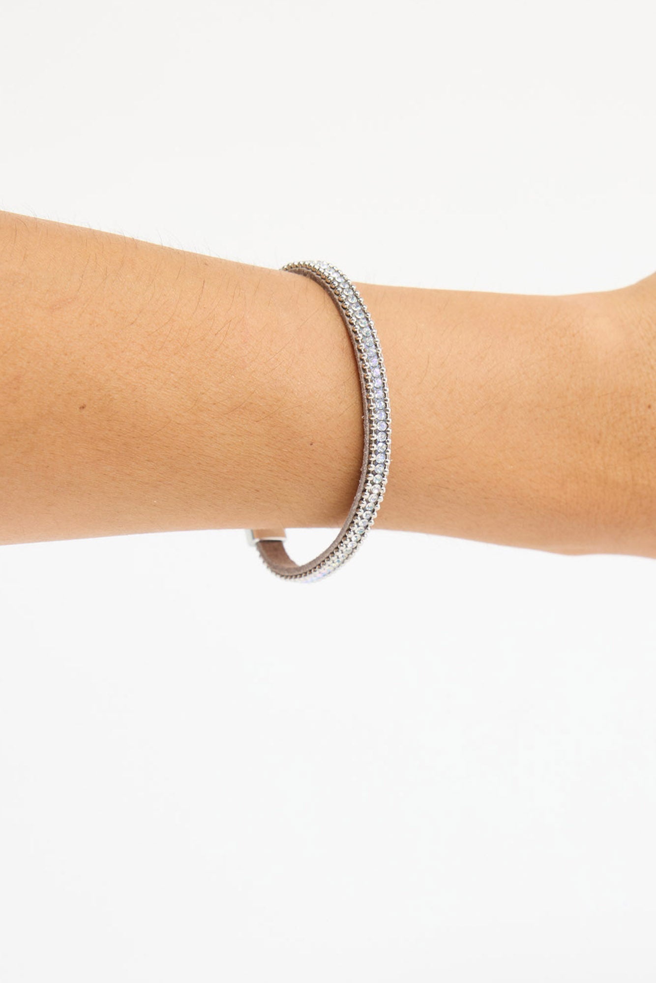 Close-up of the Harper Bracelet worn on the wrist, showing the row of clear crystals and silver-tone ball-chain trim