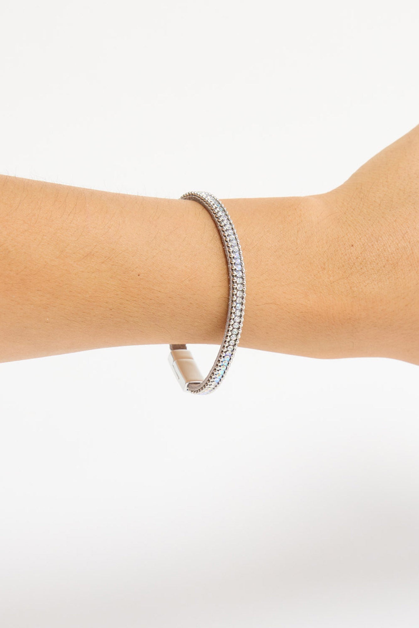 Close-up of the Harper Bracelet's magnetic clasp and crystal band worn on the wrist