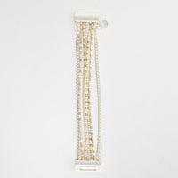 Anderson Bracelet in silver – flat lay showing multiple silver-tone chain strands with gold and silver cube beads and a bar-style clasp