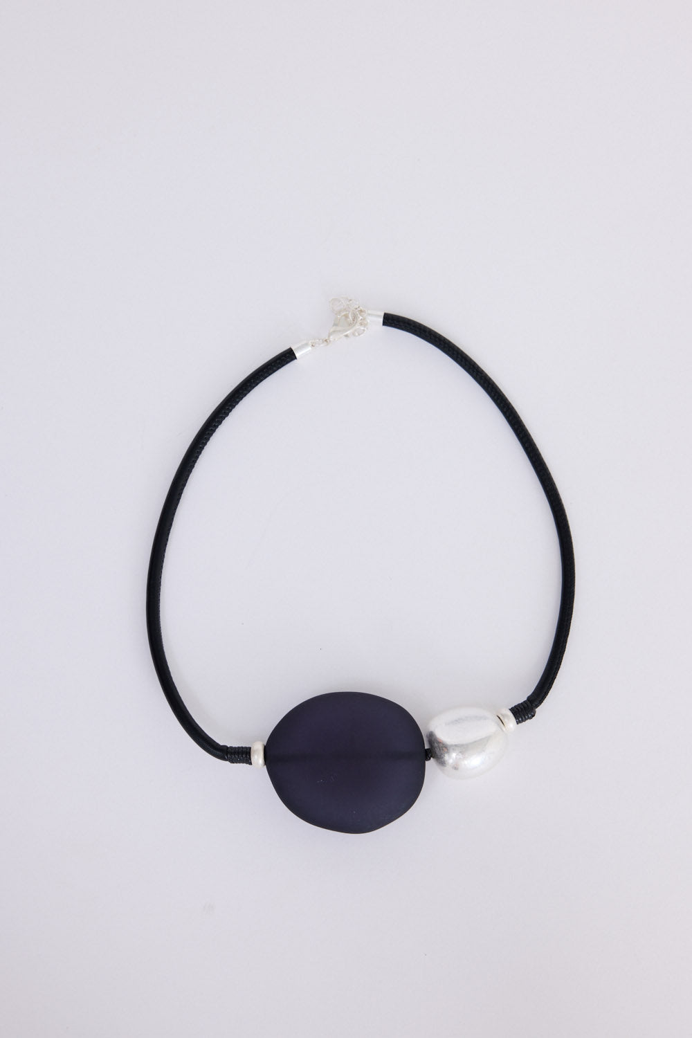 Stefani Choker in black with statement feature pendant, neckline styled view.